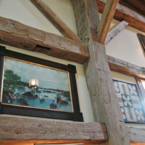 Detail of wall and exposed wooden beams_Steven Kellogg Timber Frame Home